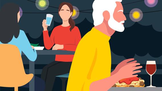 Person at restaurant with friend, watching others eat food, as they only drink water